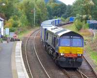 DRS 66302 about to run south through Pitlochry on 20 September 2014 with the 4D47 Inverness - Mossend intermodal.<br><br>[Bill Roberton 20/09/2014]