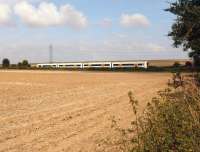 A Southeastern 4 car Class 375 emu on a Ramsgate to London Victoria service on 14 September 2014 heads west between Minster and the closed station of Grove Ferry. On the high ground is the A253 Canterbury to Ramsgate road. The photograph was taken from the delightfully named Gore Street.<br><br>[John McIntyre 14/09/2014]