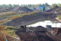 Progress on the new bridge which will carry the link from Whitehill Road over the Borders Railway and into the new recycling plant being built on the west side of Millerhill yard. View is south west towards the site of the new Shawfair station on 21 September 2014. <br><br>[John Furnevel 21/09/2014]