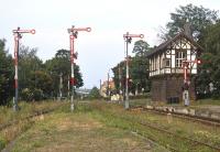 Located on the north edge of the Harz mountains, the German town of Thale is the terminus of a branch from Quedlinburg and must have been a busy location during East German days. The weeds testify to the fact that by 2002 the freight traffic had long gone but at least the attractive signal box and array of signals at the station throat survived.<br><br>[Bill Jamieson 23/08/2002]