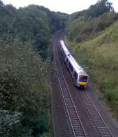 An up DMU heads South-East through Harbury cutting, between Leamington Spa and Fenny Compton in September 2014. I'm afraid those apples on the left will go to waste.<br><br>[Ken Strachan 21/09/2014]