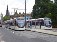 Edinburgh trams 275 and 256 meet at the Princes Street stop on 23 September.<br><br>[Bill Roberton 23/09/2014]