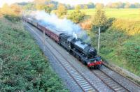 Day 4 of 4 and <I>The Great Marquess</I> is taking the 2014 <I>West Highlander</I> back to Preston after its Scottish tour. 61994 is seen passing under Cleveley Bank Lane bridge at Forton with the seven coach special. <br><br>[Mark Bartlett 22/09/2014]