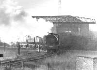 Ex-WD 75167 (Bagnall 2755/1944) shunts another rake of mineral wagons at the former Swalwell Disposal Point on the western edge of Gateshead in March 1971.<br><br>[John Furnevel 03/03/1971]