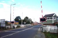 The signal box and crossing at North Seaton, Northumberland, on 24 September 2014, looking north east.<br><br>[John Steven 24/09/2014]