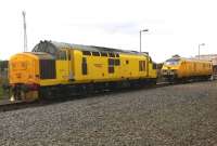 Well, there's yellow and there's yellow... The Network Rail DVT seems to have an all-over warning panel, while 97303 (formerly known as 37178) is in a lighter shade of yellow. Both were stabled just outside the depot during the Etches Park Open Day.<br><br>[Ken Strachan 13/09/2014]