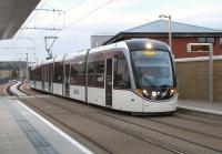 Edinburgh tram 254, bound for the Airport, arrives at Murrayfield on a September evening in 2014.<br><br>[Andrew Wilson 14/09/2014]