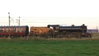 61994 <I>The Great Marquess</I> being towed back to Carnforth from Preston along with the ecs from <I>The West Highlander</I> tour in fading light on 22 September 2014. At the front were Class 37s 518 and 668 as the train passes just north of Brock.<br><br>[John McIntyre 22/09/2014]