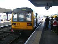 The 0921 Northern service to Huddersfield waits to leave Blackpool North on 24 September 2014. In the right background 31465 is at the adjacent platform with a Network Rail test train. <br><br>[Veronica Clibbery 24/09/2014]