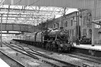 Preserved 8F No. 48151 brings the down <I>Fellsman</I> into the usual Platform 3 at Carlisle on 23 July 2014.<br><br>[Bill Jamieson 23/07/2014]