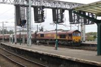 DBS 66070 draws a long rake of bogie coal hoppers into Carlisle on 29 September. The train, from Milford West to New Cumnock, had arrived via the Settle and Carlisle and waited in the station for around ten minutes before continuing northwards. <br><br>[Mark Bartlett 29/09/2014]