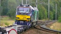 DRS 68006 with a consignment of new conflats from Motherwell TMD to Carlisle heading south on the WCML through Carstairs on 4 September 2014. The train is about to traverse the Edinburgh line crossover [see image 15041]. <br><br>[Ken Browne 04/09/2014]