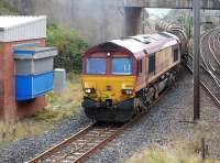 DBS 66130 taking the Kilmarnock line at Barassie on 29 September having run round on the former Troon avoiding line, with the Ayr main line to the right. [See image 48855].<br><br>[Bill Roberton 29/09/2014]