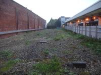 An early morning view from the windows of the newish down side waiting room at Wakefield Westgate station along the former bays towards the throat where the staircase and lift structure for the new north end footbridge is now sited.<br><br>[David Pesterfield 30/09/2014]
