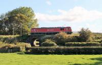 Although running as the Dollands Moor to Irvine china clay service rather than a light engine movement, DBS liveried 92031 has no payload as it passes the Oubeck Loops on 24th September 2014.  <br><br>[Mark Bartlett 24/09/2014]