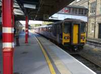 Under the canopy on Lancaster's platform 5 [see image 24912] on 6 September. Unit 153351 seems to have found a friend with whom to share its next journey.<br><br>[Ken Strachan 06/09/2014]