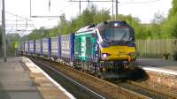 One of the recently introduced class 68s, DRS 68005, passing through Coatbridge Central on 14 September with the Inverness to Mossend Tesco Express Intermodal service.<br><br>[Ken Browne 14/09/2014]