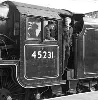 Gordon Hodgson looks back attentively from the driving seat of Black 5 No. 45231 awaiting the signal to move the ecs of <I>The Fellsman</I> out of platform 3 at Carlisle on 23 September 2009.<br><br>[Bill Jamieson 23/09/2009]