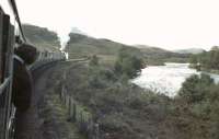 View west from a window of the Inverness - Kyle of Lochalsh <I>Raven's Rock Express</I> shortly after passing through Lochluichart station on 25 September 1982. Black 5 no 5025 is at the head of the train [see image 48908]  [Ref query 6932].<br><br>[John Robin 25/09/1982]