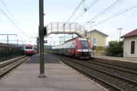 40 years of multiple unit development is illustrated at Rivesaltes station in September 2014.  A 27500 class EMU built by Bombardier in 2005 departs with a Montpellier to Cerbre train whilst Caravelle DMU No 4545 of 1965 vintage waits to leave with the 10:00 TPCF service to St Paul de Fenouillet where passengers will continue their journey in locomotive hauled stock to Axat.<br><br>[Malcolm Chattwood 21/09/2014]