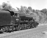 Stanier 8F 48151 gets into its stride on 23 July 2014 as it passes the former goods yard at Appleby, shortly after restarting with the southbound <I>Fellsman</I>.	<br><br>[Bill Jamieson 23/07/2014]