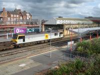 Former long term stored locomotive 92024 <I>J S Bach</I> on the through road between platforms 11 and 12 at Crewe Station on 20 July 2014. The train had arrived off the Chester line with a short rake of repaired assorted stock heading for Bescot yard.<br><br>[David Pesterfield 20/07/2014]