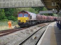 66129 manoeuvering a rake of mixed BYA & continental steel wagons opposite platform 1 at Swindon station on 29 August 2014. [See image 48596]<br><br>[David Pesterfield 29/08/2014]