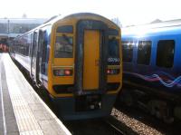 The 1417 Northern arrival from York stands at Blackpool North on 24 September alongside the 1440 TransPennine departure for Manchester Airport.<br><br>[Veronica Clibbery 24/09/2014]