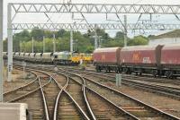 Traffic jam at the south end of Carlisle station on 29 September 2014 as Freightliner 66539, coming off the Shap route with a Fiddlers Ferry to Hunterston train, takes the back road to overtake another empties train. The DBS train had just arrived from the Settle and Carlisle route [See image 48866] heading for New Cumnock and followed the Heavy Haul train towards the G&SW route soon after.<br><br>[Mark Bartlett 29/09/2014]