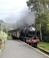 Ex-WD Austerity 2-8-0, liveried as BR 90733, draws into Oakworth station with a service to Haworth and Ingrow on 27th September 2014.<br><br>[Brian Taylor 27/09/2014]