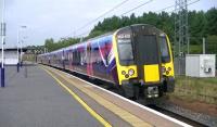 TransPennine 350401 on 1M96 Glasgow Central to Manchester Airport passing Carstairs on 4 September.<br><br>[Ken Browne 04/09/2014]