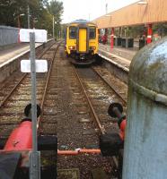 Northern 156489 has just arrived at Lancaster platform 2 on 6 September. The moss encrusted tank in the foreground appears to be an air tank for pneumatic buffers.<br><br>[Ken Strachan 06/09/2014]