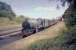 GWR Castle class 4-6-0 no 7029 <I>Clun Castle</I> passes through the former station at West Wycombe (closed November 1958) in the summer of 1964 with a train of empty stock for Birmingham. Withdrawn by BR at the end of 1965, the locomotive has since been preserved. <br><br>[John Robin /08/1964]