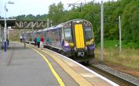 Scotrail EMU 380113 with the 1050 Ayr - Edinburgh Waverley calls at Carstairs on 4 September.<br><br>[Ken Browne 04/09/2014]