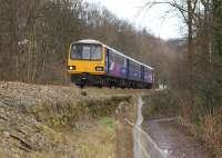 144019 heads west from Todmorden with a Leeds to Manchester Victoria stopping service on 10 February 2014.<br><br>[John McIntyre 10/02/2014]