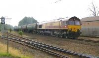 The Dalston - Grangemouth Ineos empties returning north through Carstairs on 4 September 2014 behind DBS 66124.<br><br>[Ken Browne 04/09/2014]