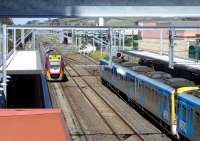 A VR Vlocity DMU leaves Sunbury for Melbourne on 30 September while a Metro EMU stands at the other platform. The whole station has been transformed by electrification. [See image 41779]<br><br>[Colin Miller 30/09/2014]