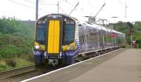 The 1218 Glasgow Central - Ardrossan Harbour formed by Scotrail EMU 380108 calls at Ardrossan South Beach on 13 August 2014.<br><br>[Ken Browne 13/08/2014]