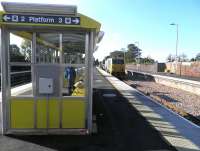 A railhead treatment train hurries east along the new bidirectional third track at Huyton on 12 October. The fourth track beyond will be brought into use as soon as the compulsory purchase of land alongside allows.<br><br>[John Yellowlees 12/10/2014]