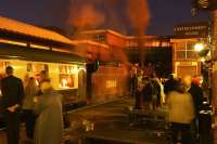 Ex LMS Crab no. 13065 at the head of the East Lancashire Railway's <I>Red Rose Diner</I> at Bury Bolton Street on the evening of 10 October, featuring intending passengers, as well as those visiting the hostelry on the platform.<br><br>[John McIntyre 10/10/2014]