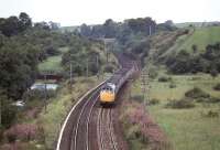 A Type 2 diesel drops down towards Dunblane in 1980 with a train from Dundee.<br><br>[John Robin //1980]