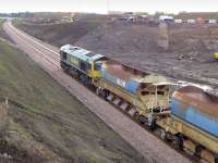 Freightliner 66602 on the south end of an empty autoballaster at Shawfair on 14 October.<br><br>[Bill Roberton 14/10/2014]