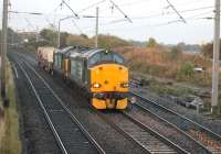 The morning Crewe - Sellafield nuclear flask train runs alongside Morecambe Bay at Hest Bank on 16 October behind DRS 37602 and 37610.<br><br>[Mark Bartlett 16/10/2014]