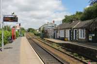 Bromley Cross between trains. This view is towards Blackburn and the signal at the end of the platform protects the single line section to the passing loop at Darwen. The signal box and surviving station buildings, which contain the still staffed booking office, are on the Bolton and Manchester platform. <br><br>[Mark Bartlett 20/06/2014]