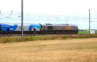 GBRf imported former <I>Eurospec</I> class 66 no 66747 heads north at Beningbrough on 18 October 2014 with a rake of empty Drax Power biomass wagons.  <br><br>[David Pesterfield 18/10/2014]