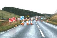The new road bridge which will carry the A7 over the Borders Railway at Falahill was recently opened to single-file traffic. View shows the southern approach to the new bridge on Sunday 19 October 2014, with the trackbed visible on the far left.<br><br>[John Furnevel 19/10/2014]
