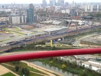 Looking south from the ArcelorMittal Orbit in Stratford's Olympic Park on 18 October 2014. View is across the GE main line towards the elevated Pudding Mill Lane station on the Docklands Light Railway. In the area between the two rail routes work is currently underway on the Crossrail project.<br><br>[John Thorn 18/10/2014]