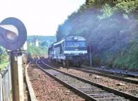 SNCF B-B 67303 and a classmate throw up an exhaust plume as they climb the gradient out of Cherbourg heading south in the summer of 1979. Introduced in 1967 the loco was already twelve years old at the time of this photo and in 2014 was still in service, along with 30 other survivors of the once 90 strong 673xx Class.<br><br>[Mark Bartlett //1979]