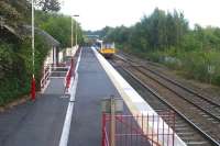 A Hexham - Middlesbrough service departs from the staggered eastbound platform at Haltwhistle in September 2003. <br><br>[John Furnevel 21/09/2003]