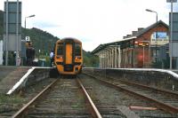 The 1652 service to Pwllheli about to depart Porthmadog on 13th October 2014. The former station building has been restored after being damaged in the storms in February 2014. [See image 47963]<br><br>[Colin McDonald 13/10/2014]